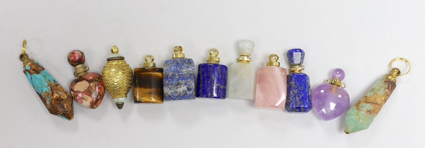 Eleven assorted gilt metal mounted hardstone and semi-precious stone small scent bottles, including Tiger's eye, rose quartz, lapis lazuli and amethyst.